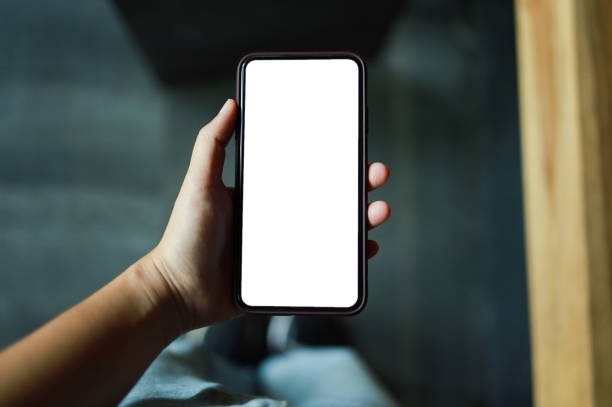 istock Women's hands holding cell telephone blank copy space screen. smart phone with technology concept 1558389808