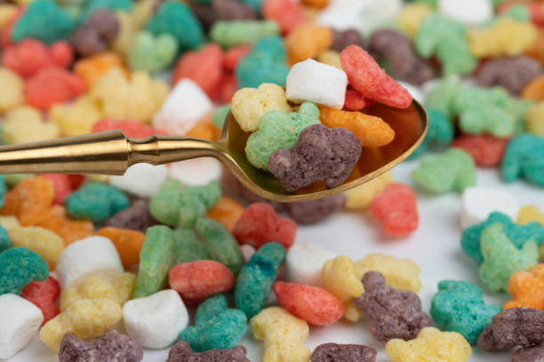 istock Colorful cornflakes in spoon 1558391557