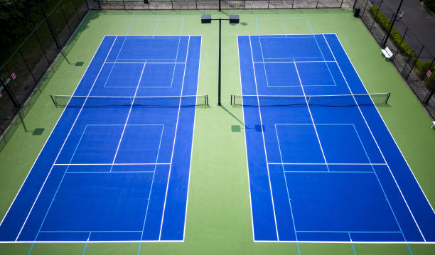 istock Looking down at two pickleball and tennis courts from a drone 1558409108