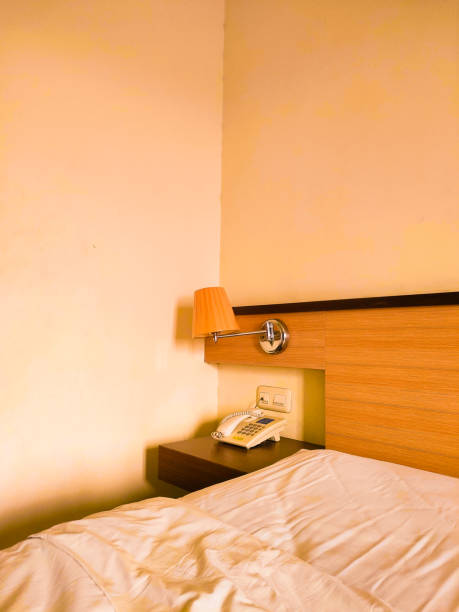 istock A Beautifully Decorated Hotel Bedroom with Exquisite White Bedding 1558443420