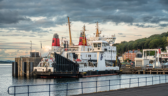 The MV Corran (2001) in Rothesay Harbour, Isle of Bute where she is moored as she waits for an essential part. She normally plies a five-minute journey between Ardgour and Corran on the long, narrow Loch Linnhe, operated by the Highland Council. The MV Bute (Eilean Bhoid) is moored behind her.