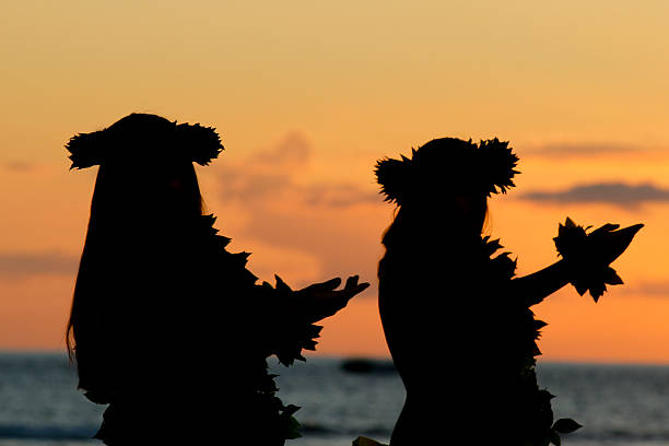 Hawaiian Hula Hawaiian girls dancing the hula at sunset, Maui luau stock pictures, royalty-free photos & images