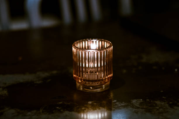 istock A candle standing on the table stock photo 1558505144