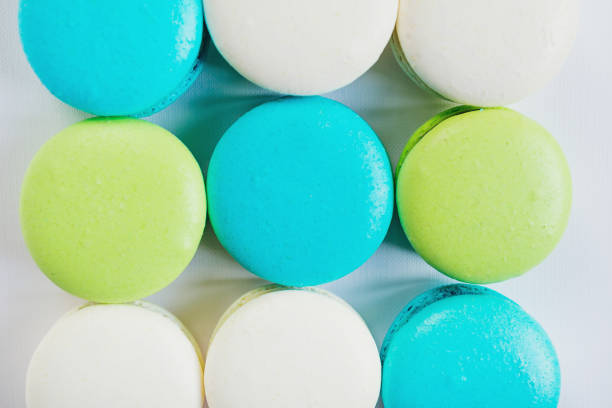 Assorted sweet colourful macaroons on white background. Dessert