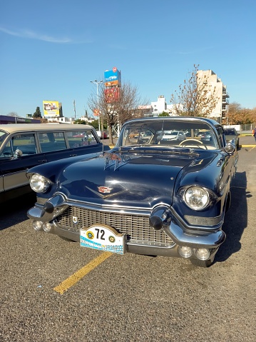 Buenos Aires, Argentina – May 29, 2023: Old blue luxury 1957 Cadillac Sedan De Ville four-door in a parking lot.