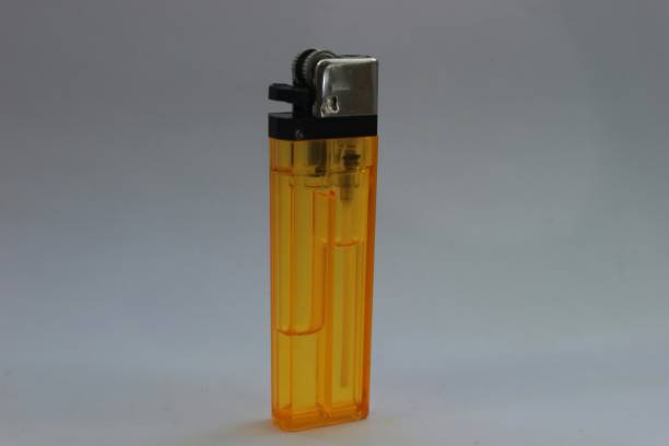 istock a very nice yellow gas lighter on a bright white background 1558514830