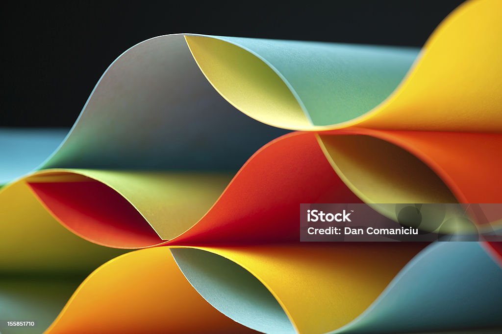 detail of waved colored paper structure graphic abstract image of colorful origami pattern made of curved sheets of paper Paper Stock Photo