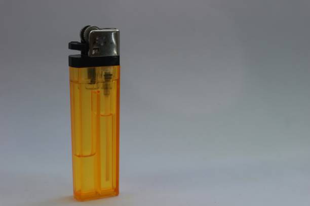 istock a very nice yellow gas lighter on a bright white background 1558518830