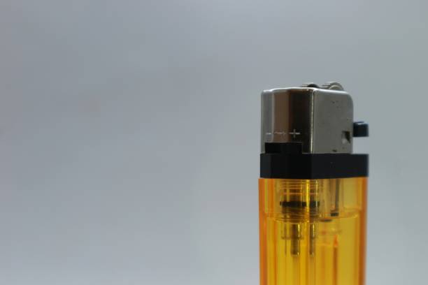 istock a very nice yellow gas lighter on a bright white background 1558519890