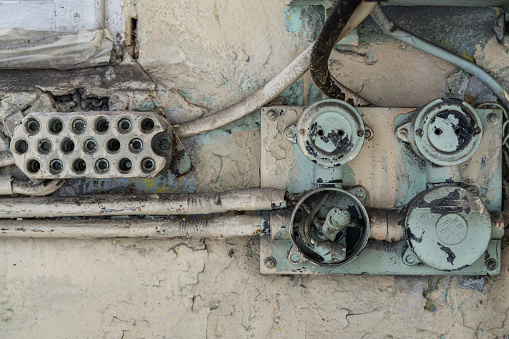 Old electrical equipment in an abandoned factory building