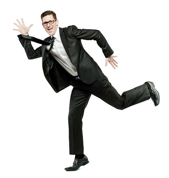istock Happy businessman runs in black suit on white. 155852531