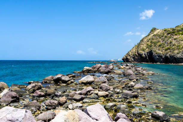 istock Lagoon and sea is divided by rocks 1558539003
