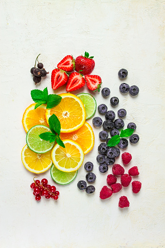 mix of fruits and berries,set, assortment, sliced citrus fruits, raspberries, blueberries, mint leaves, strawberries, red currants, food background, fruit wallpaper,