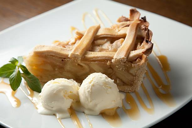 apple pie apple pie on white plate with vanilla ice cream apple pie and ice cream stock pictures, royalty-free photos & images