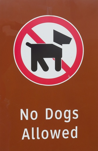 No dogs allowed sign at Tallgrass Prairie Preserve, Kansas. International 'do not' sign as entering the bison refuge part of the park.