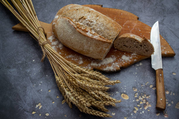istock fresh baked bread with wheat ears 1558605599