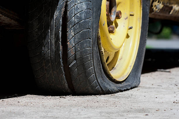istock Flat tire of old car 155861078