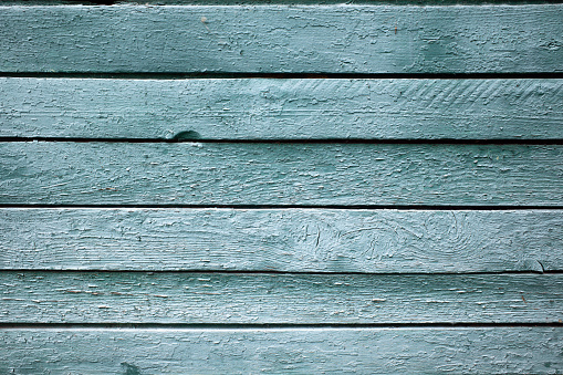 Texture background of old wooden grunge plank light green turquoise, full frame