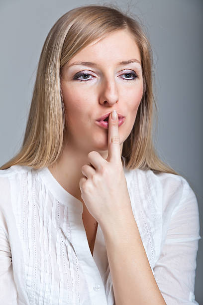 istock Woman shh on gray background 155863888