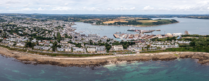 Falmouth, Cornwall, UK - July 5, 2023.  Aerial landscape panorama view of the Coast Road with docks and harbour in the Cornish coast town of Falmouth