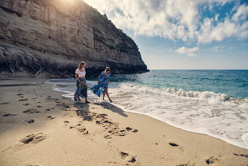 Mother and daughter walking together on the beautiful beach.
Shot with Canon R5