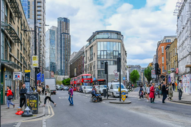 Bethnal Road and junction of Brick Lane London, UK, 23 May 2023: Bethnal Road and junction of Brick Lane, Shoreditch, London high street shops stock pictures, royalty-free photos & images