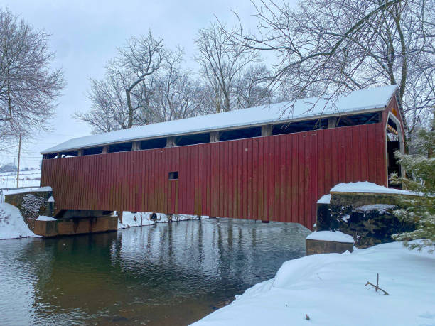 istock A Covered Bridge with a snowy landscape 1558689629