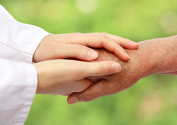 istock Women hand helping senior patient 155870704