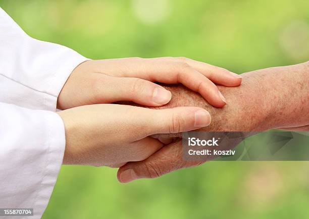 Women Hand Helping Senior Patient Stock Photo - Download Image Now - Holding Hands, Patient, Doctor