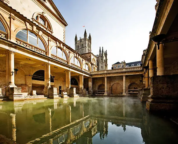 Roman Baths with Bath Abbey reflection in Bath, England