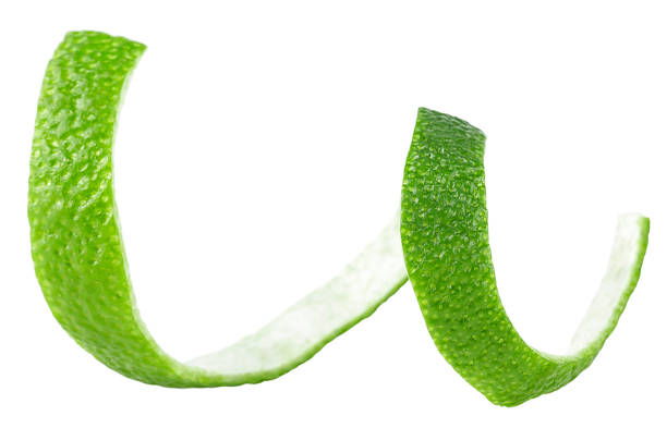 istock Skin of fresh lime isolated on a white background. Lime fruit peel. 1558762541