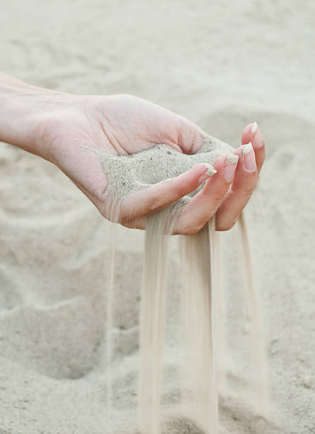 istock Sand running through the fingers 155876505