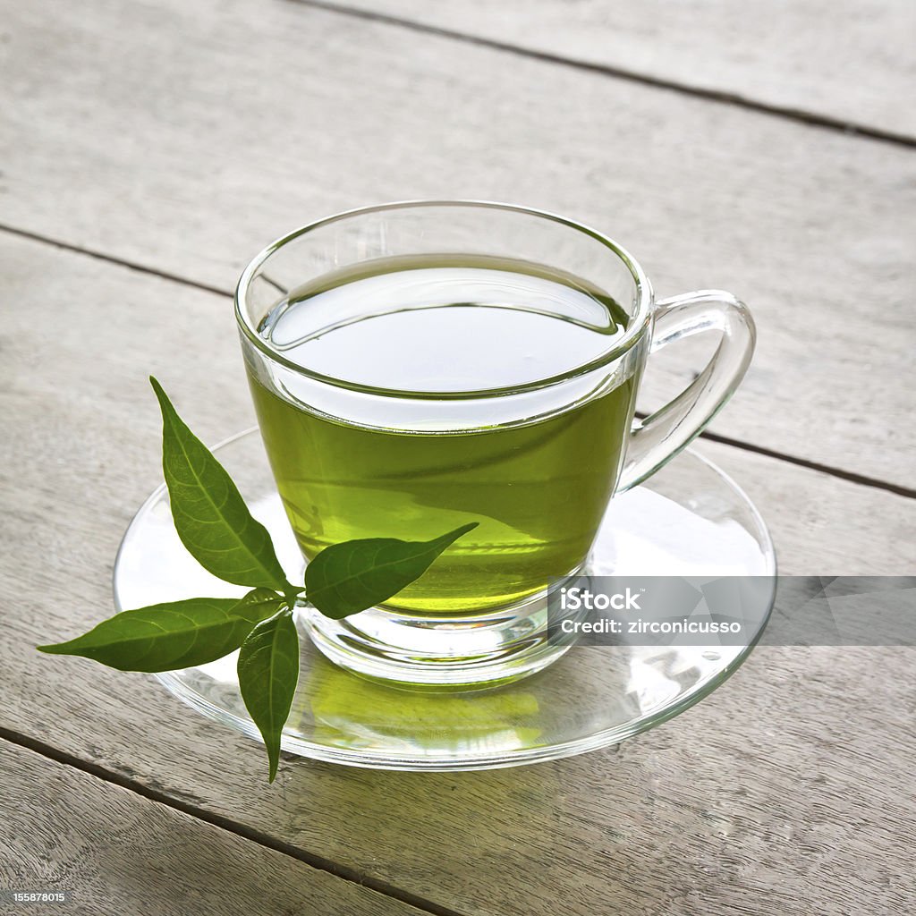 green tea a cup of green tea on wood board, drink for health Crockery Stock Photo