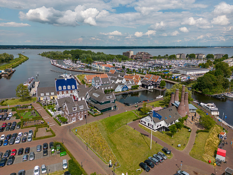 This aerial drone photo shows the harbour side of Huizen in Utrecht. Huizen has some beautiful dutch architecture.