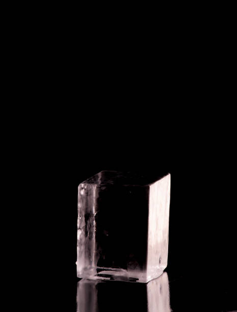 istock perfect smooth crystalline translucent ice cube isolated on black background on black table black background from the front 1558806332