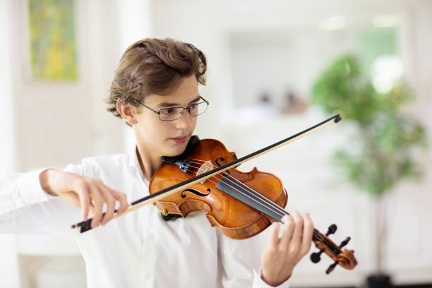istock Man playing violin. Classical music instrument. 1558823301