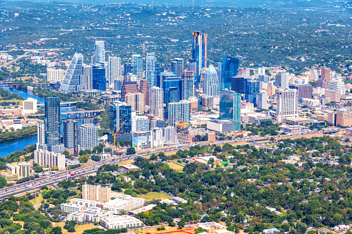 Aerial view of the buildings along the banks of the Colorado River in downtown Austin, Texas from about 1000 feet in altitude during a helicopter photo flight.