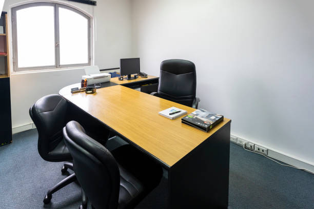 istock Empty office in a classic style with a large desk 1558881338