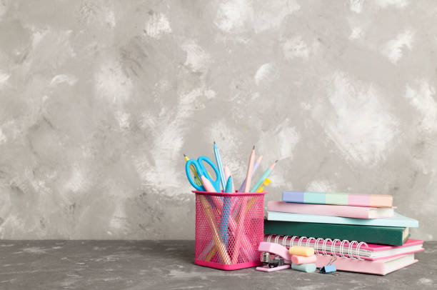 istock Composition with books and stationery on concrete table. Back to school concept 1558899302