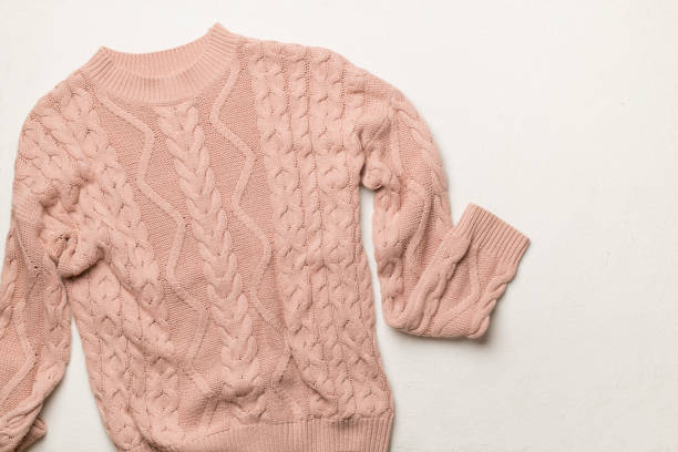 istock Winter sweater on concrete background, top view 1558923432