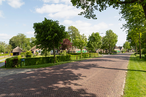 Street through the rural village of Rouveen in the municipality of Staphorst in Overijssel in the Netherlands.