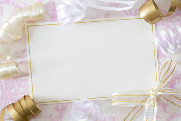 istock Party invitation with gold ribbons 1558947706