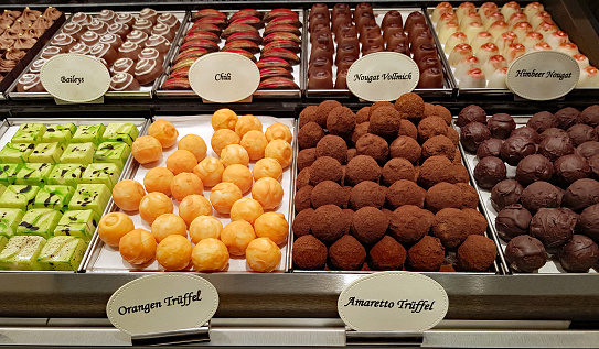 Selection of chocolate in a row, shop in Belgium.