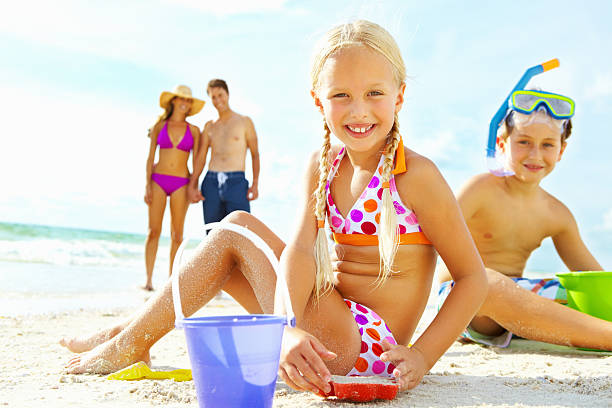 istock Boy and girl playing in the sand 155900314