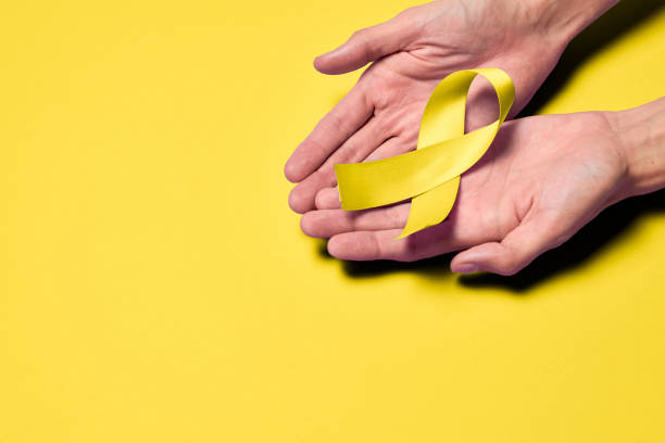 istock World Suicide Prevention Day, Yellow ribbon. 1559032626