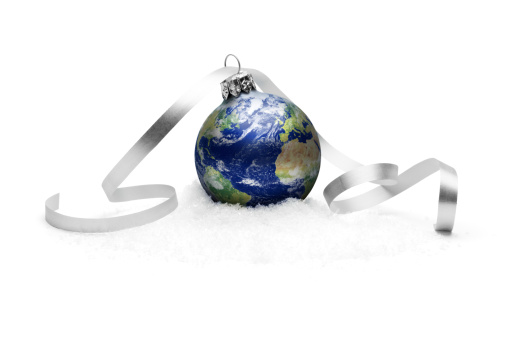 Composite of the earth as christmas bauble.