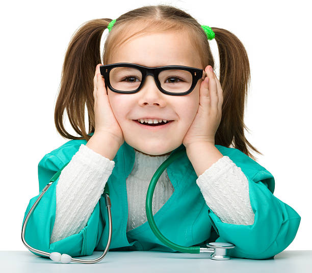Little girl is playing doctor with stethoscope stock photo