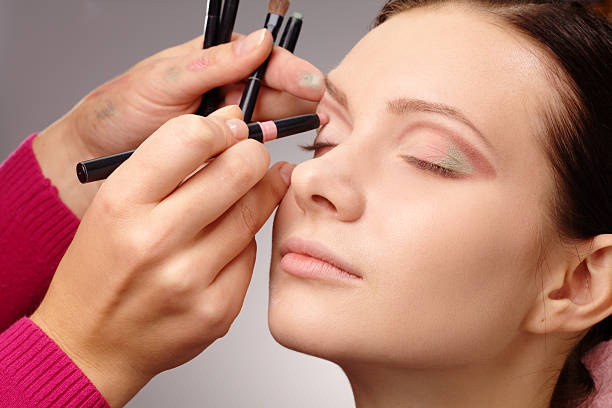 istock Applying eyeshadow for young girl 155906093