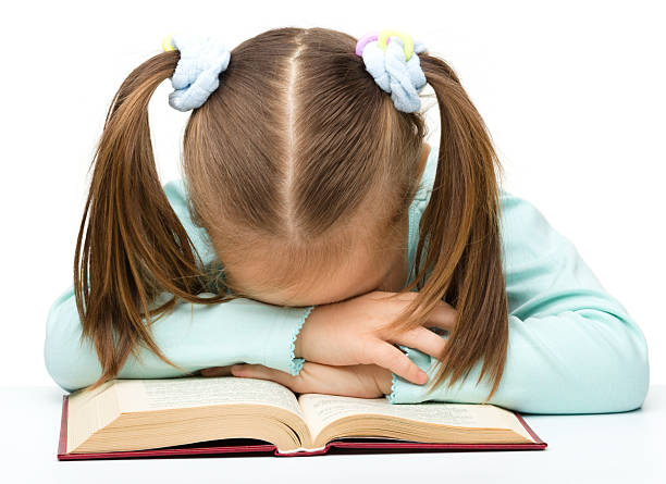 istock Cute little girl is sleeping on a book 155906227