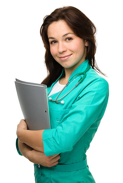 Portrait of a happy young woman doctor stock photo